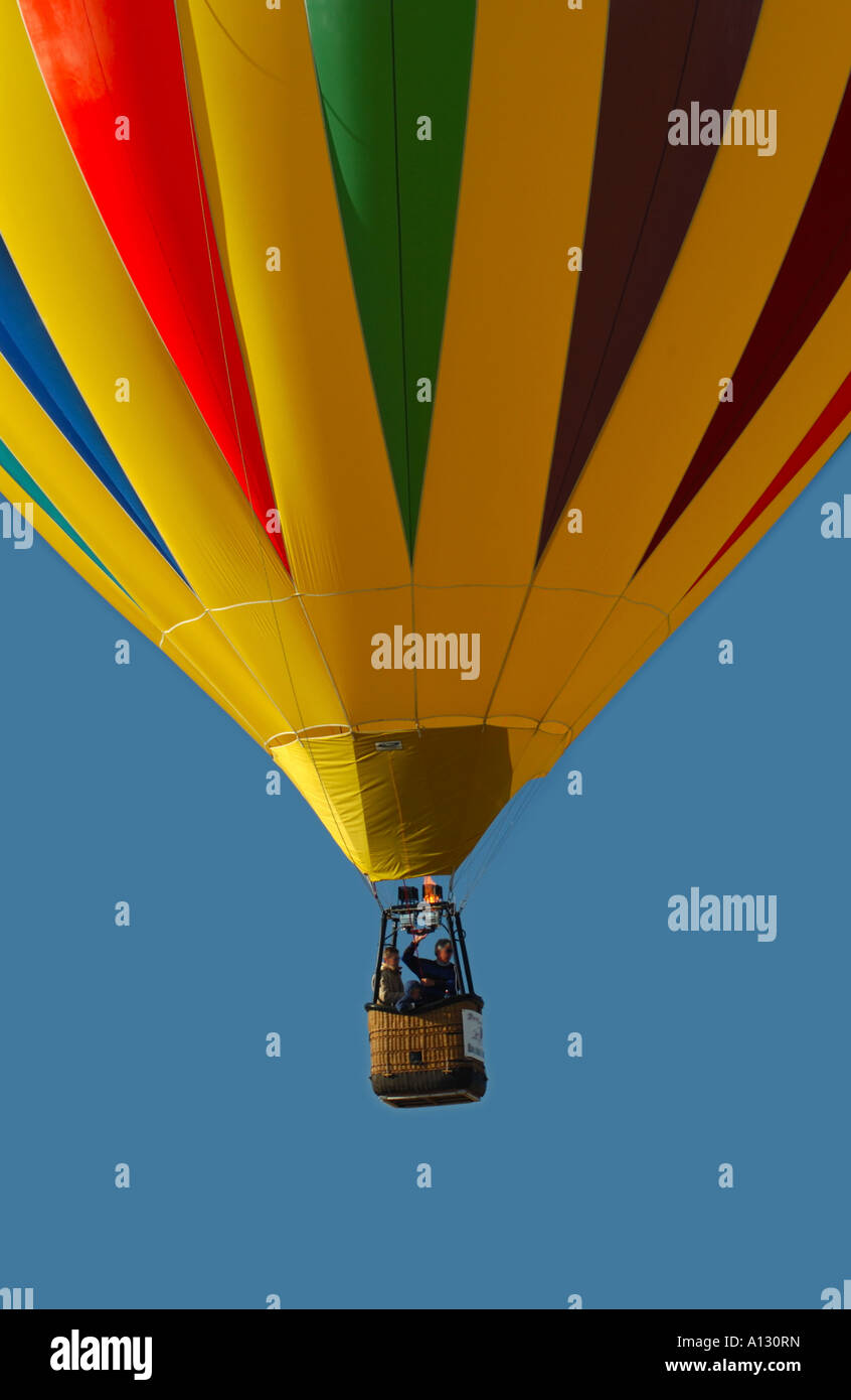 single colorful hot air balloon against a blue sky Stock Photo - Alamy
