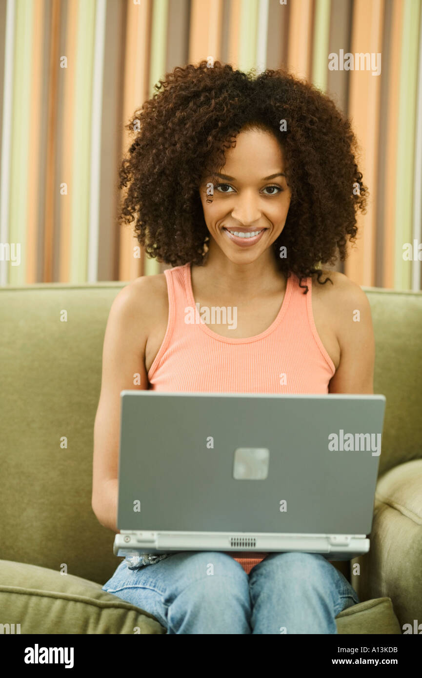 Cheerful black woman typing hi-res stock photography and images - Alamy