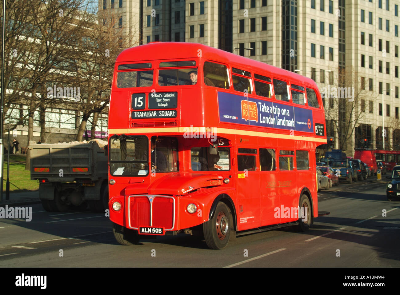 London Tower Hill refurbished Routemaster bus on tourist route 15 with advertising promoting  Heritage Routes Stock Photo