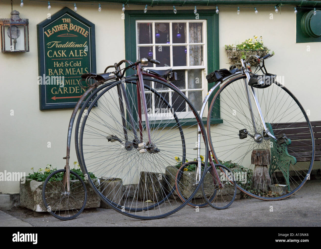 Two Penny Farthings  outside The leather bottle pub Pleshey Essex Stock Photo