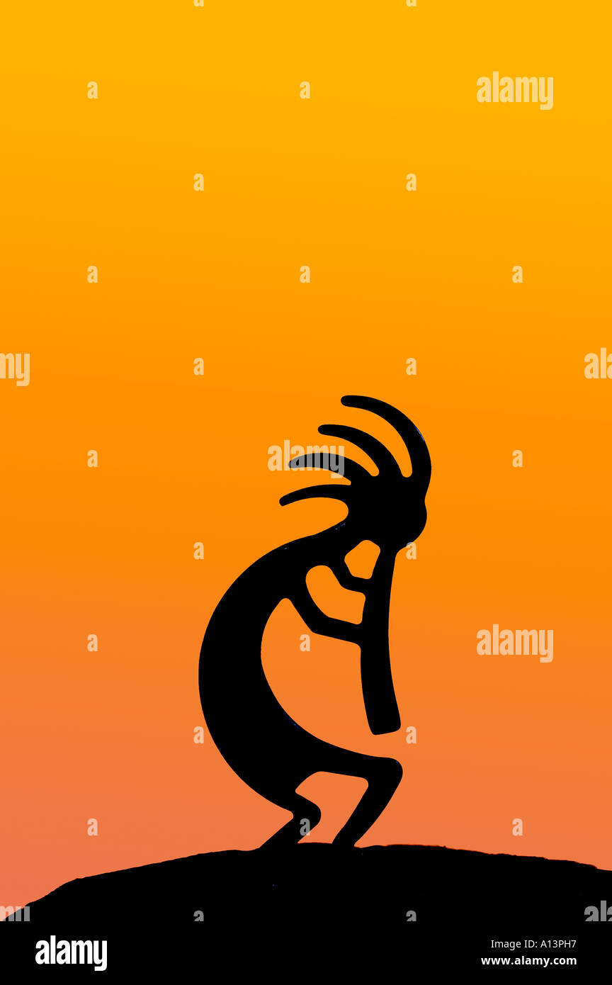 Silhouette of Kokopelli figure against terracotta colour wash Stock