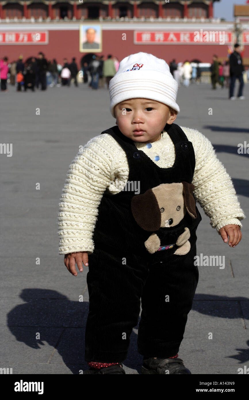 Baby in Tiananmen Square, Beijing China, Mao Zedong Portrait Stock Photo