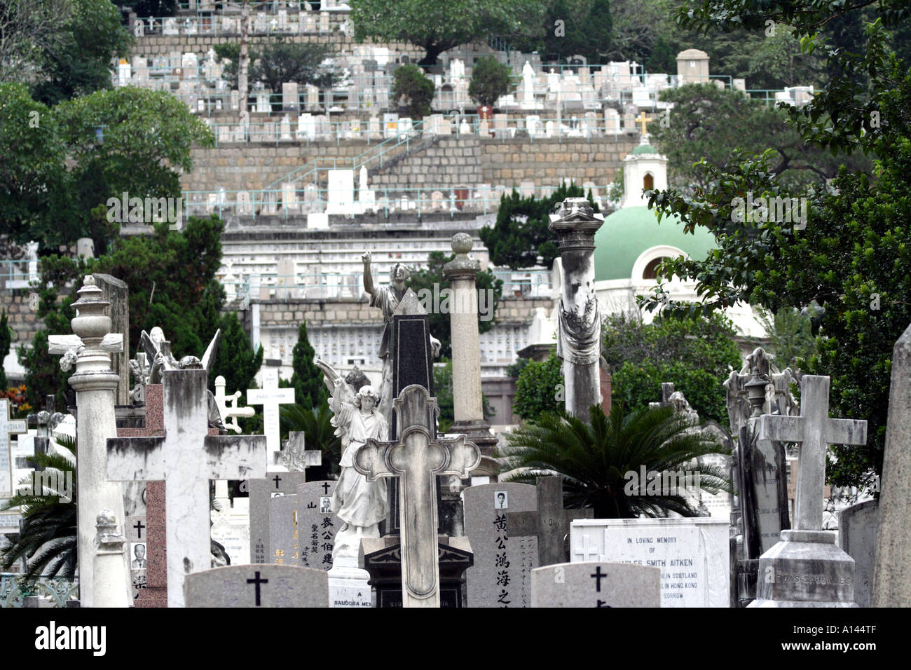 Gravestones and statues at the Hong Kong Cemetery Stock Photo