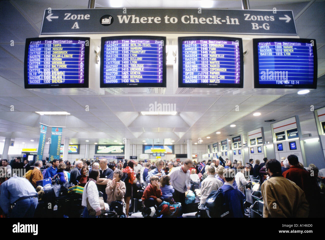 Check-in queue at Gatwick airport London UK Stock Photo - Alamy