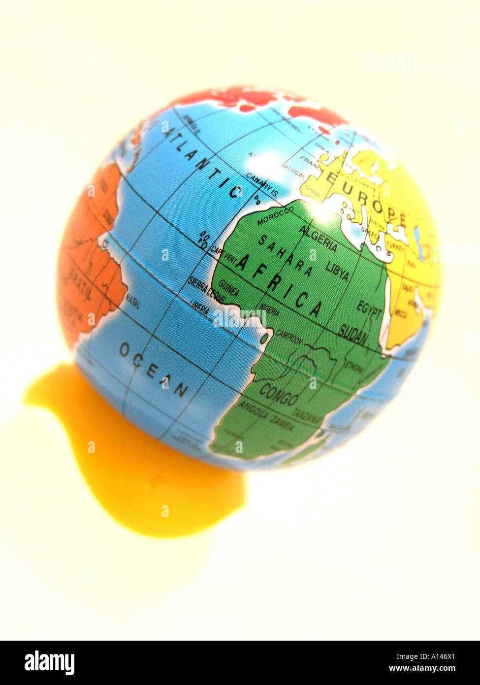 World map globe against white background Stock Photo - Alamy