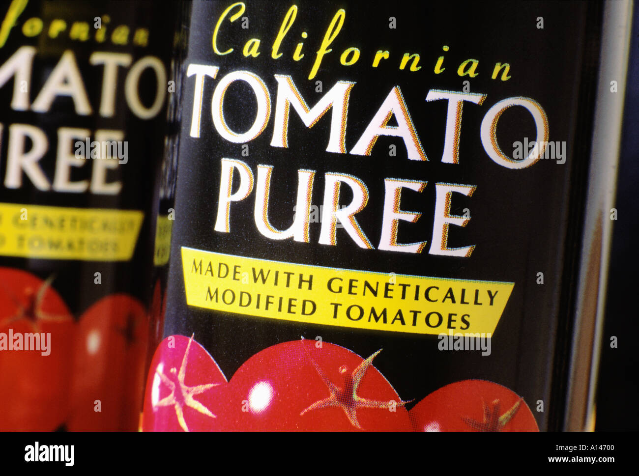Tins of tomato puree made from genetically modified tomatoes Stock Photo
