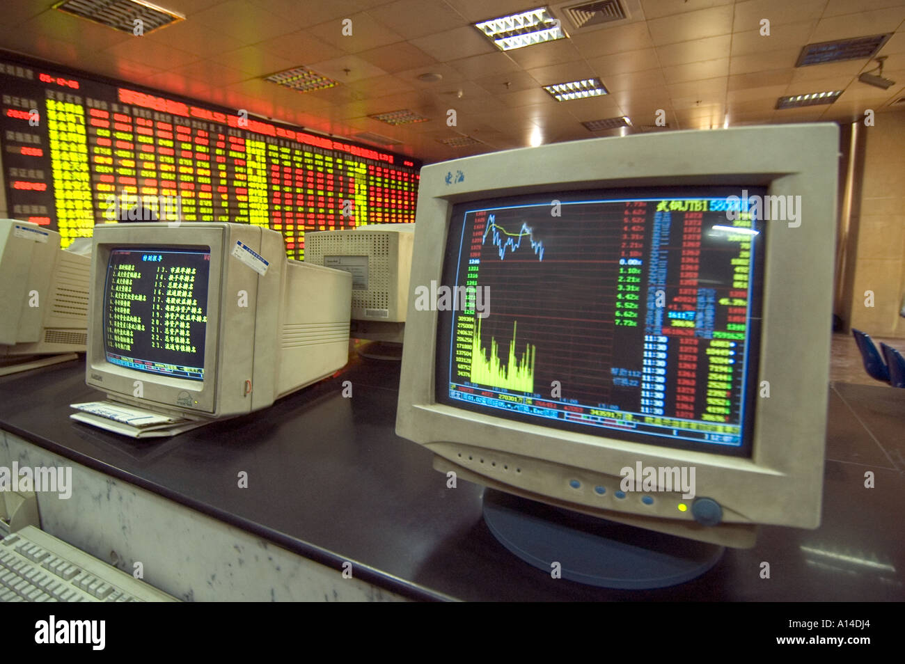 Computer screens displaying chart, graph, and diagram from the Shanghai stock market exchange. Stock Photo
