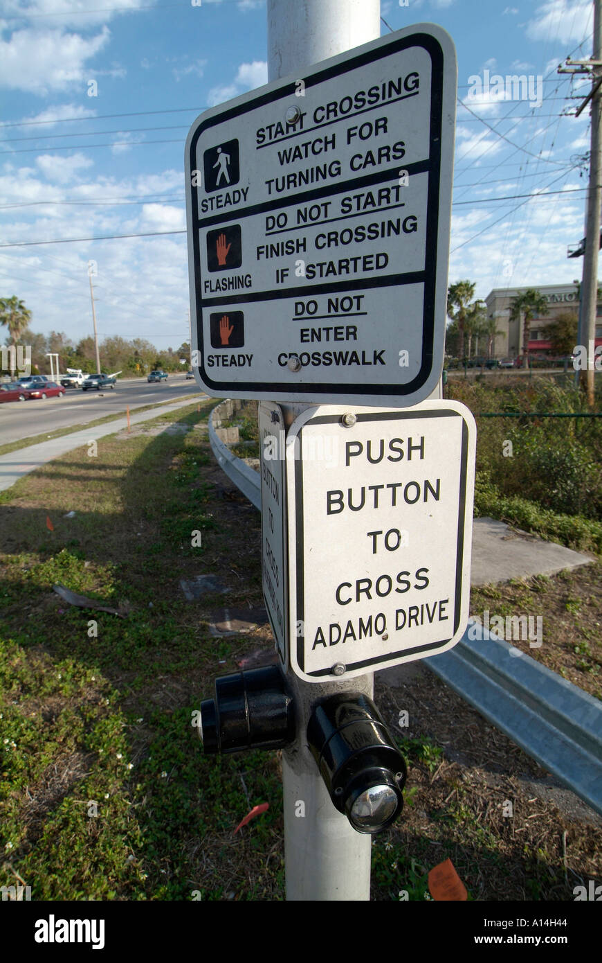 Instructions and directions on how to cross the street at a busy