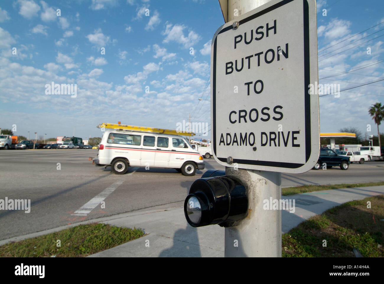Instructions and directions on how to cross the street at a busy intersection Stock Photo Alamy