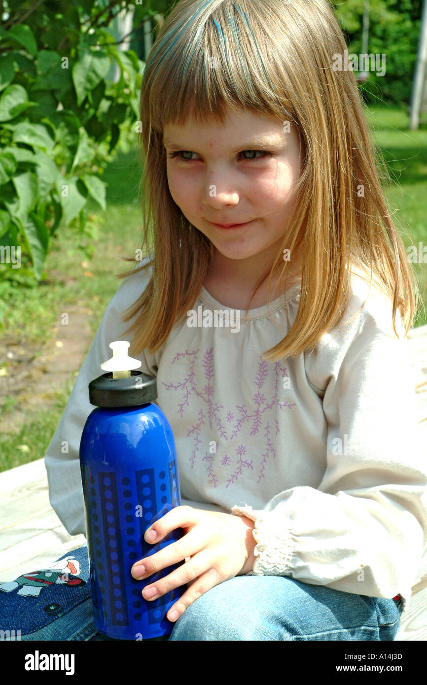girl drinks from drinking bottle Stock Photo Alamy