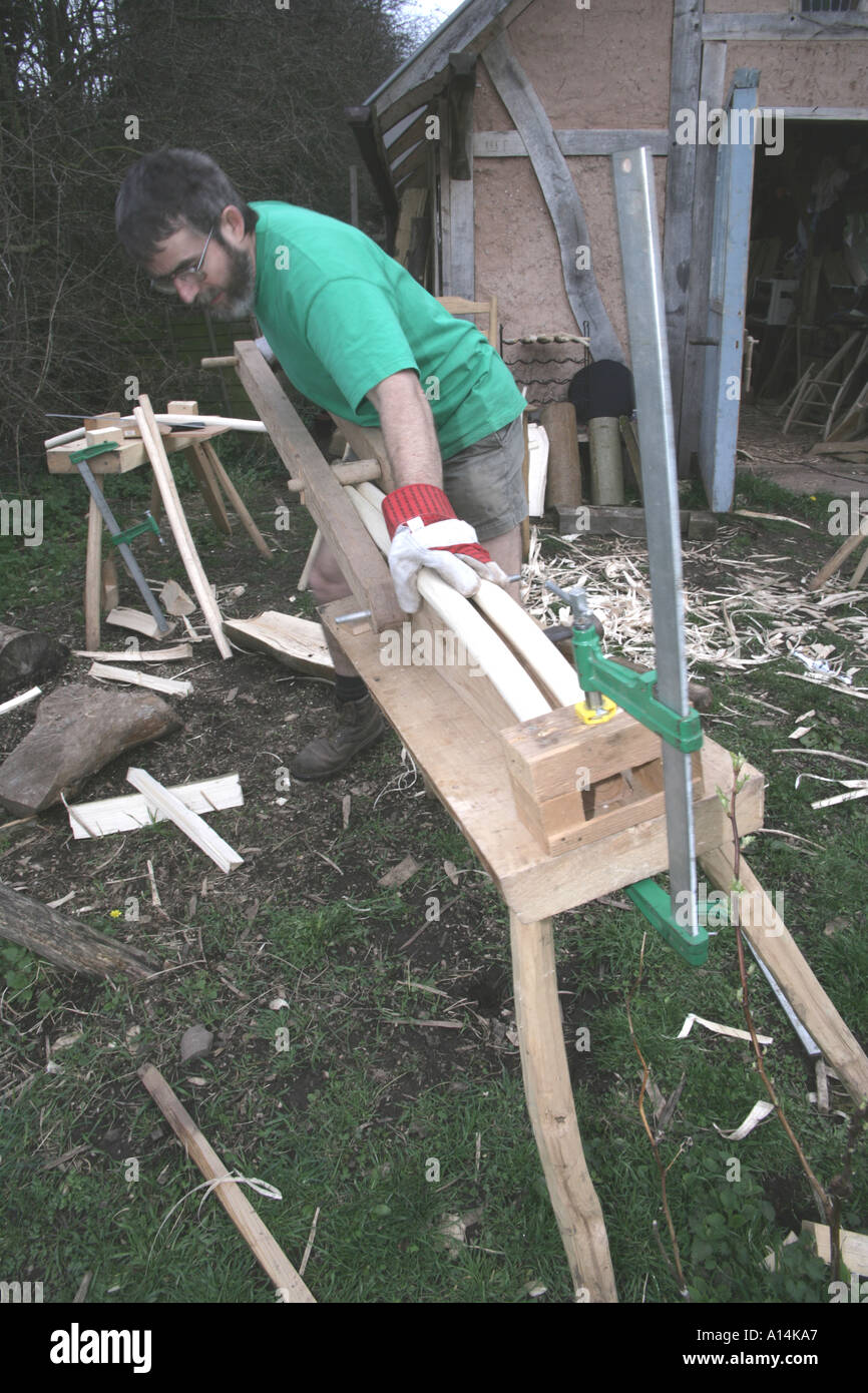 Greenwood Chair Maker working on parts for a ladderback chair Stock Photo