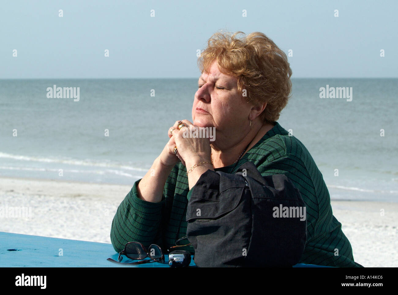 Visitors to St Pete Beach and Pasa Grille Florida engage in exercise relaxation and hobbies while vacationing Stock Photo