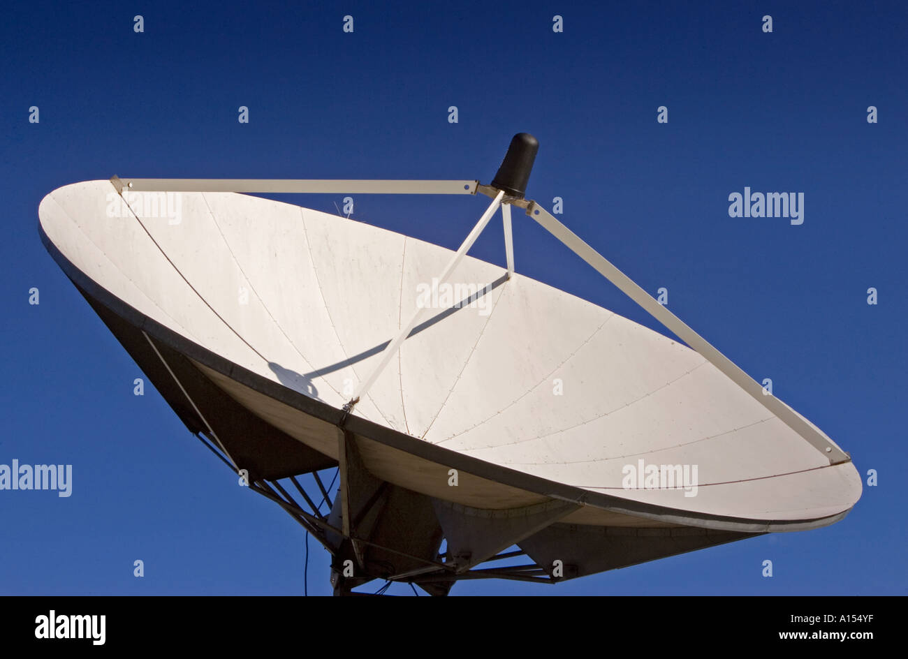 Satellite dish aimed at the sky Stock Photo