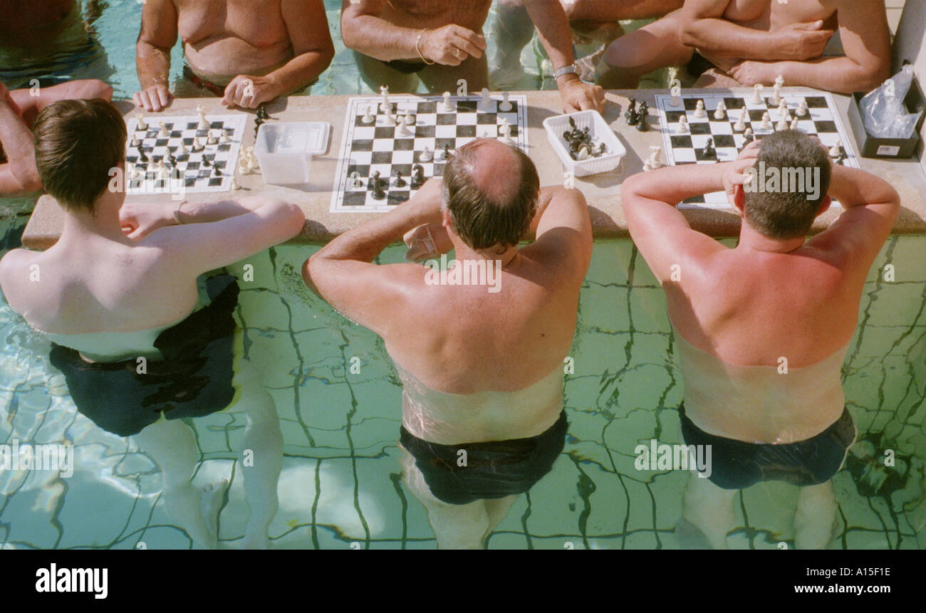 Hungarians and foreign tourists play chess at the Szechenyi baths in Budapest Hungary in late May 2000. The spas are a place Stock Photo