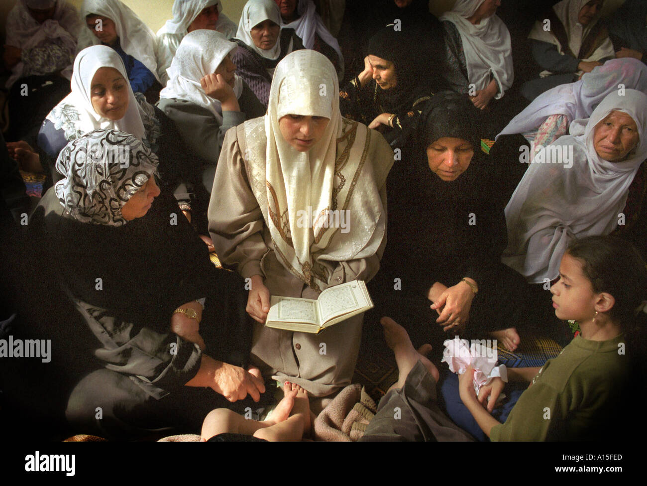 Muslim women pray at the funeral of Yusuf Khalifa 18 in Gaza Monday October 9 2000 Photo by Ami Vitale Stock Photo