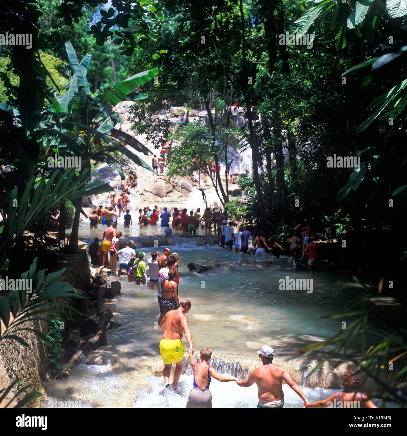 TOURISTS CLIMBING DUNNS RIVER FALLS OCHO RIOS JAMAICA Stock Photo