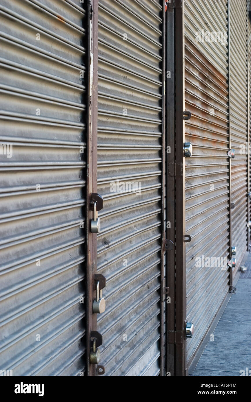 Metal gates on store fronts Stock Photo Alamy