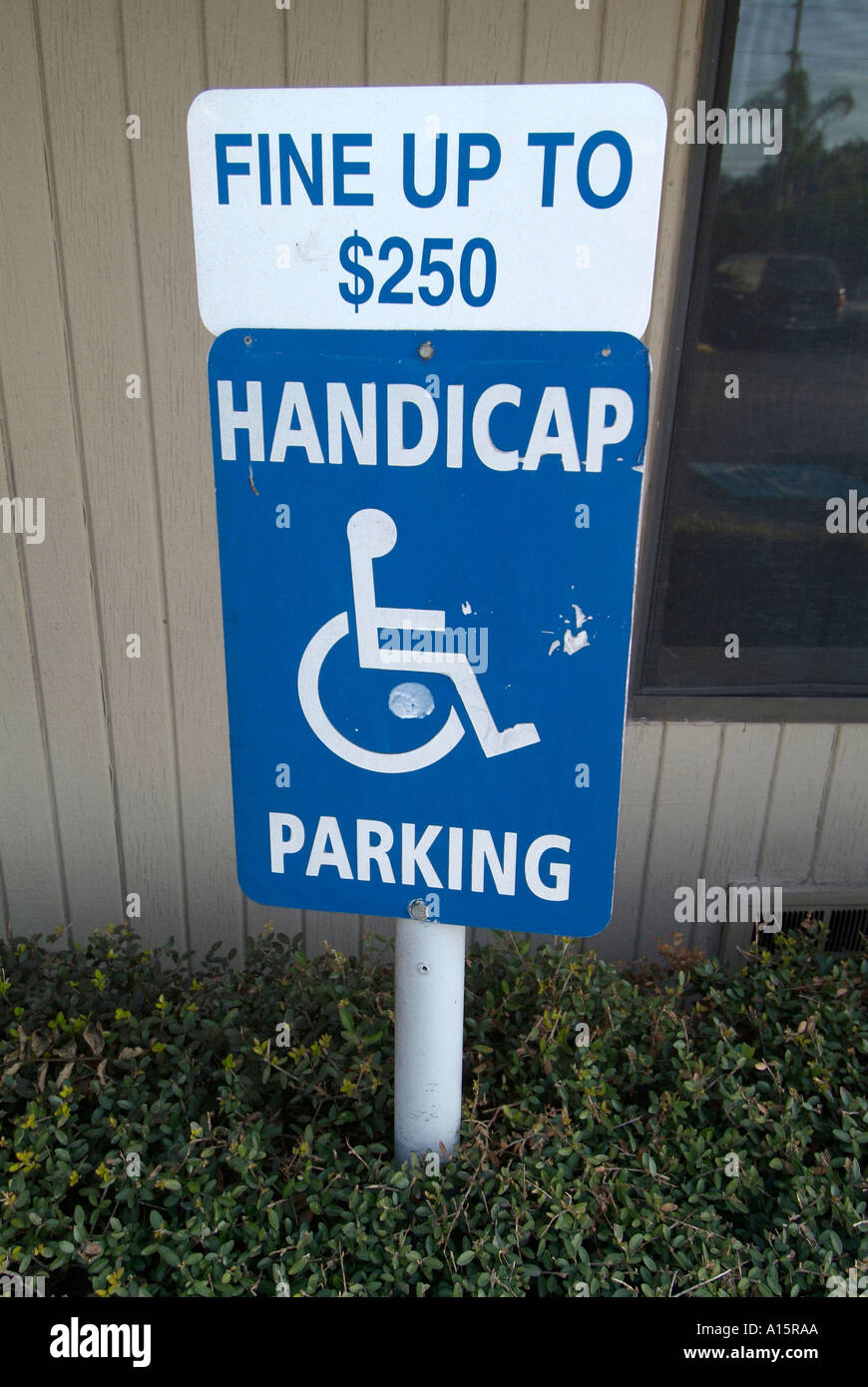Handicapped parking sign with fines posted Stock Photo - Alamy