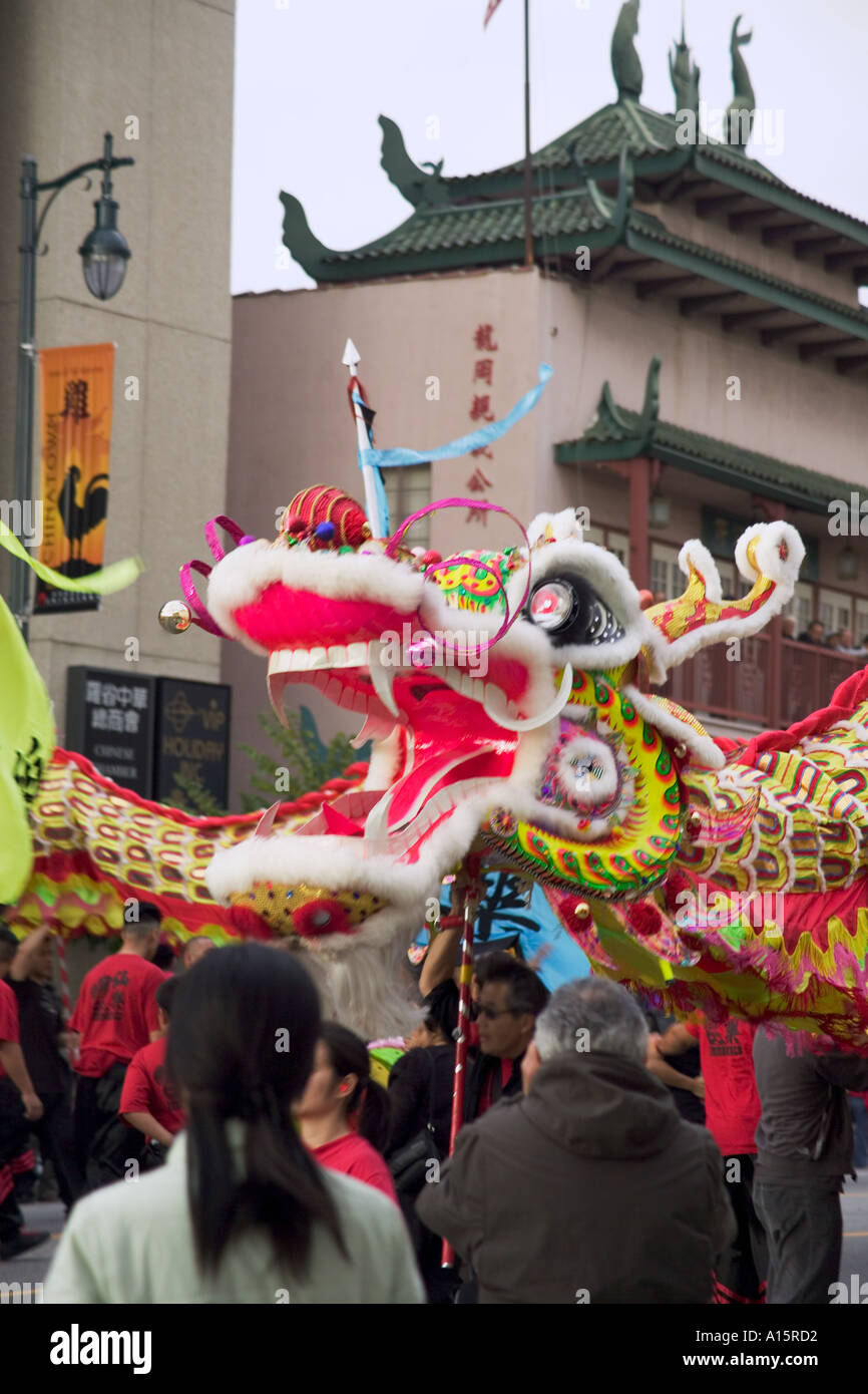 Chinese new year celebration with head of Chinese dragon and mouth open and people watching in Los Angeles California USA Stock Photo