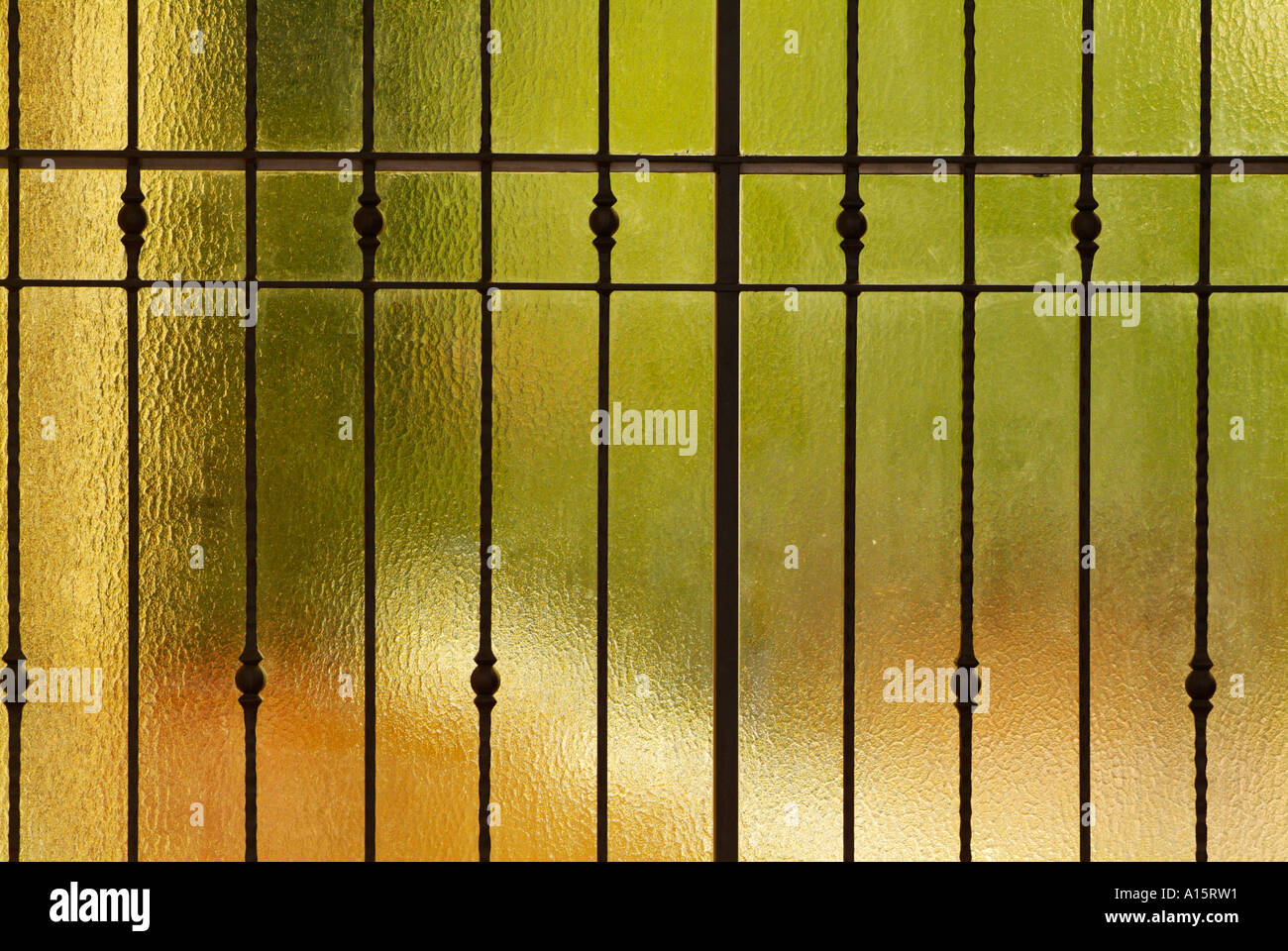Glass door with steel fence behind  Italy EU Europe Stock Photo