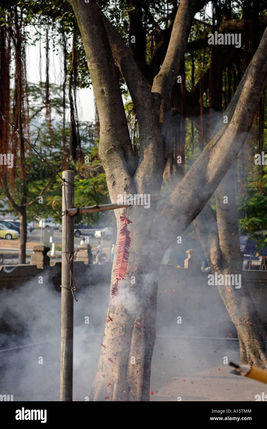 A string of fire crackers set off in a Buddhist temple Stock Photo - Alamy