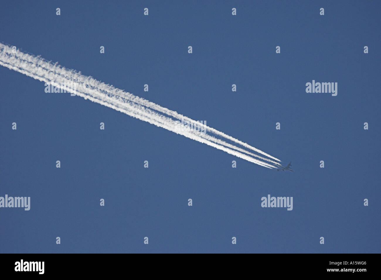 Vapour trail from airliner in a blue sky. Stock Photo