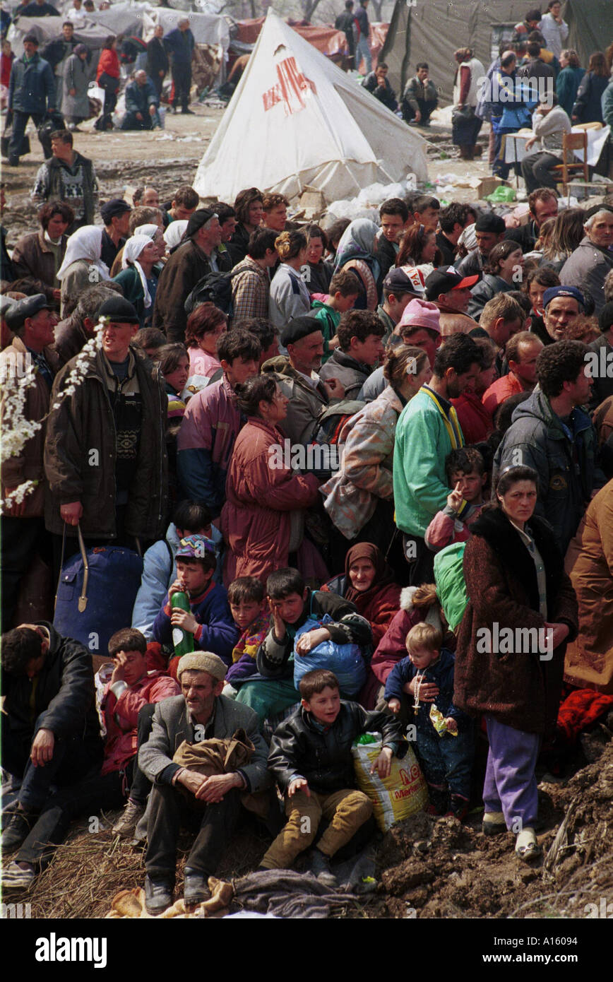 Ethnic Albanian refugees from Kosovo wait to board buses at the massive camp in Blace Macedonia Tuesday April 6 1999 where some Stock Photo