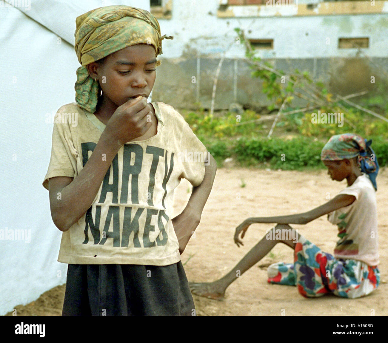 Angolans who are suffering from severe malnutrition wait to be treated in Kuito Angola. Angola's brutal 26 year-civil has Stock Photo