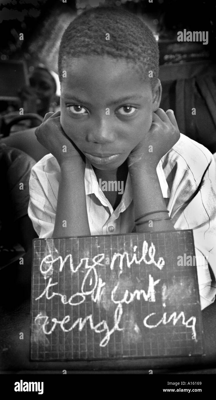 A Senegalese girl who is a refugee from the war in Casamance studies French in makeshift school in Ziguinchor Senegal. Rebels Stock Photo