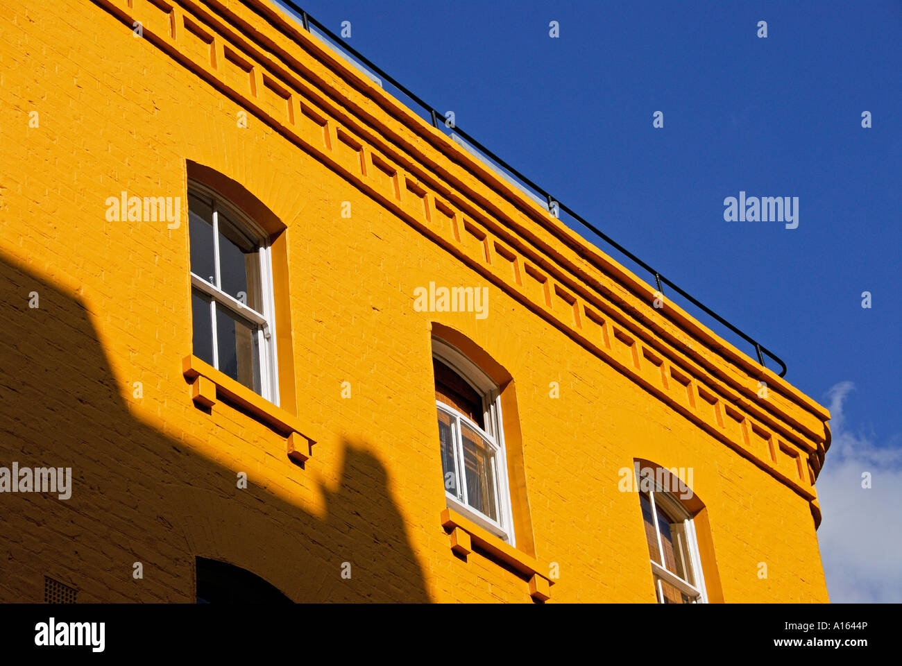 "Yellow painted "19th century" "brick building", London" Stock Photo