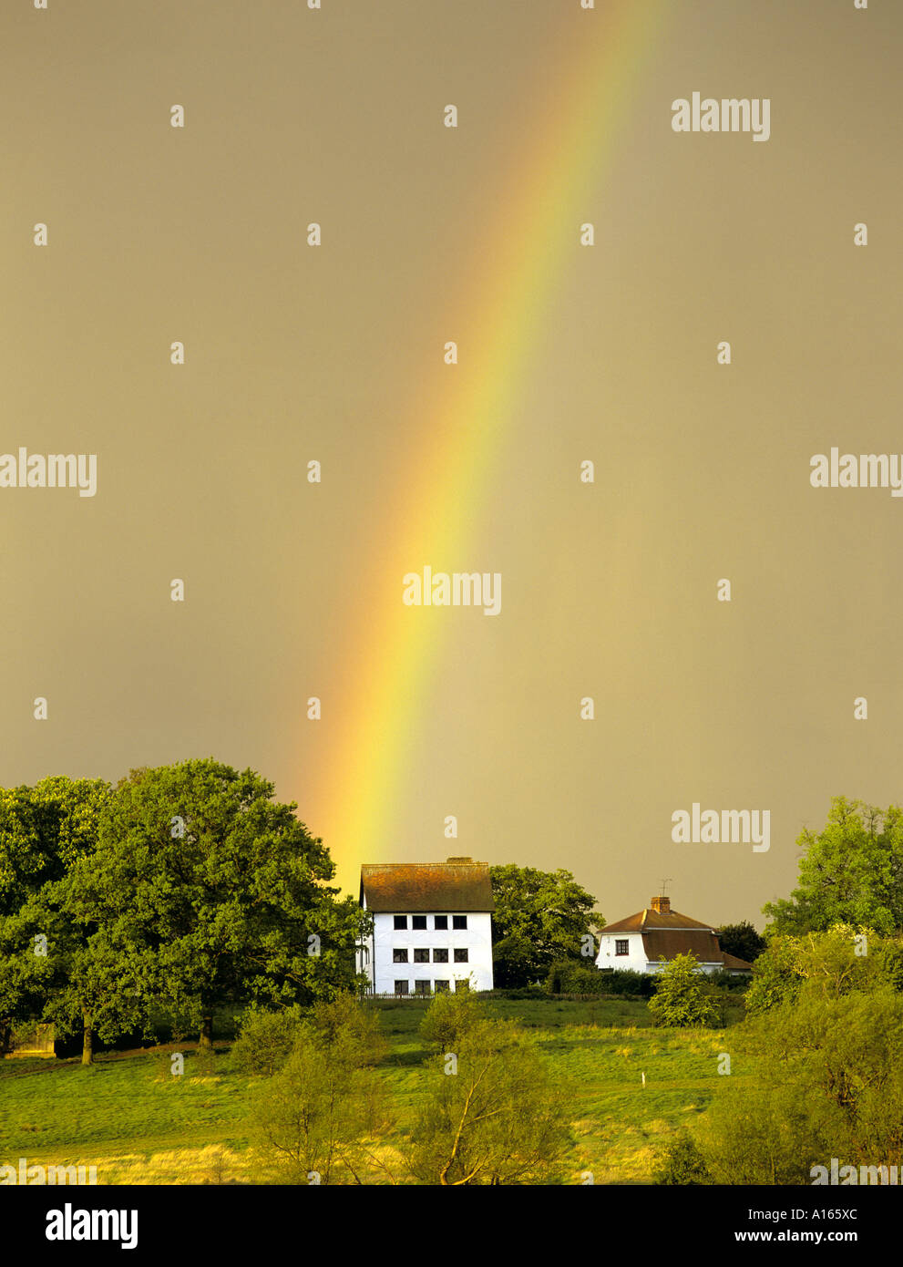 Rainbow over hunting lodge built by Henry the Eighth Epping Forest Chingford Essex England UK Stock Photo