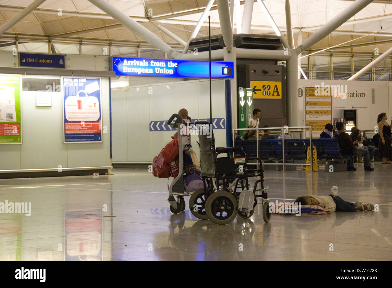 People waiting for their baggage in luggage reclaim during a baggage