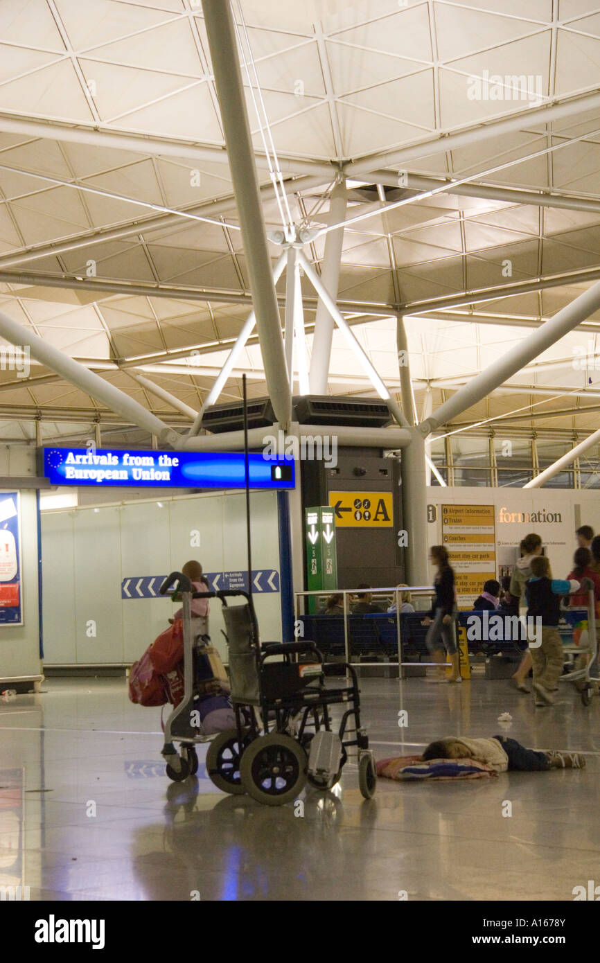 People waiting for their baggage in luggage reclaim during a baggage