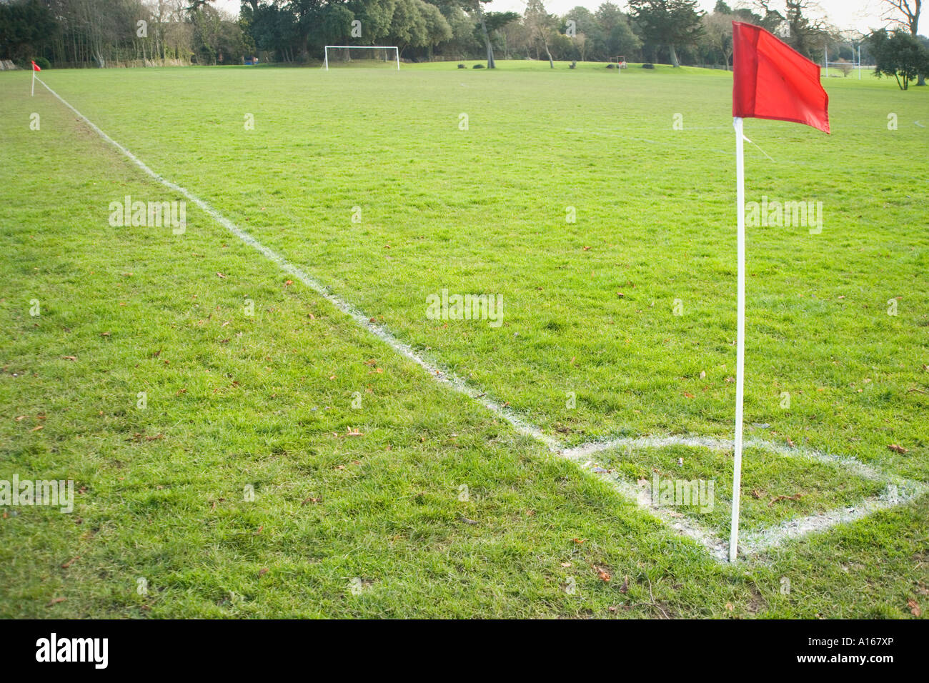 Red corner flag on soccer pitch Stock Photo Alamy