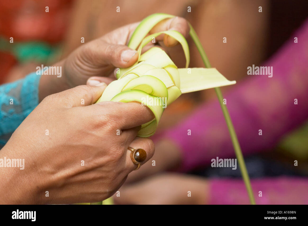 Woman Making Leaf Offering Stock Photo