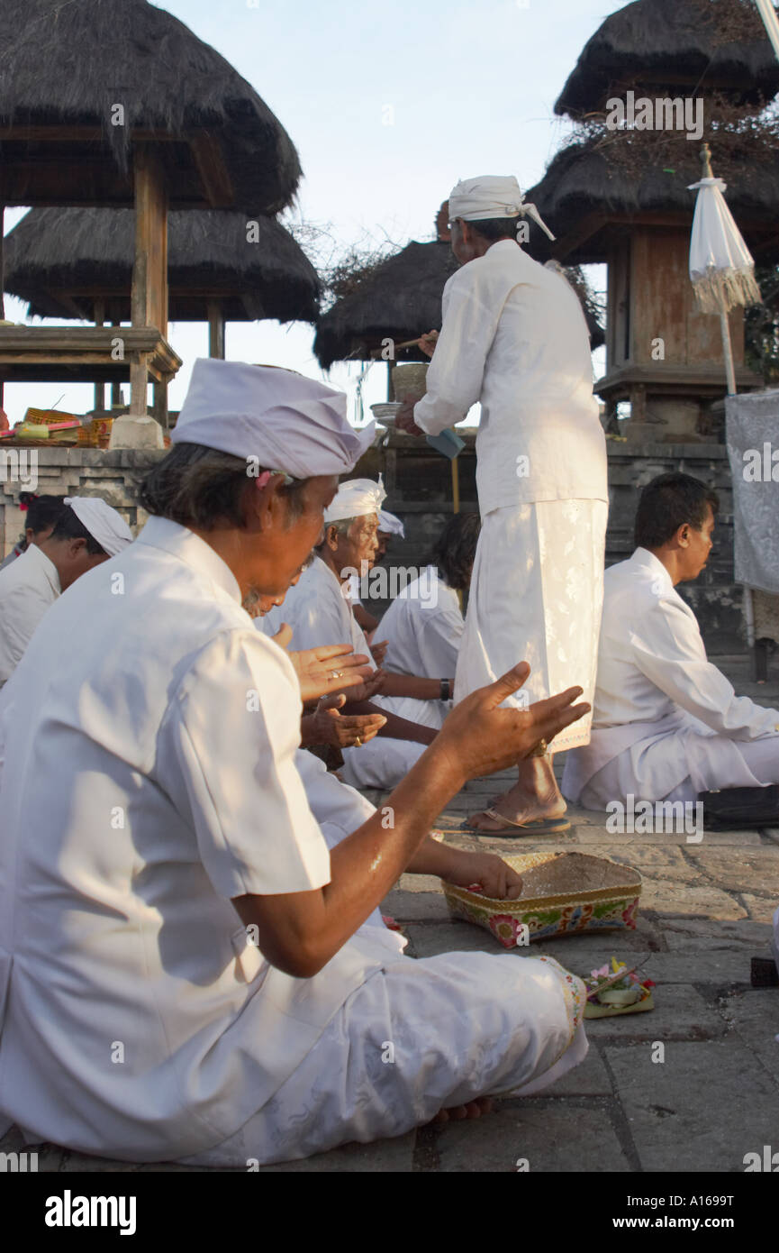 Worshippers Receiving Blessing At Temple , Bali Stock Photo