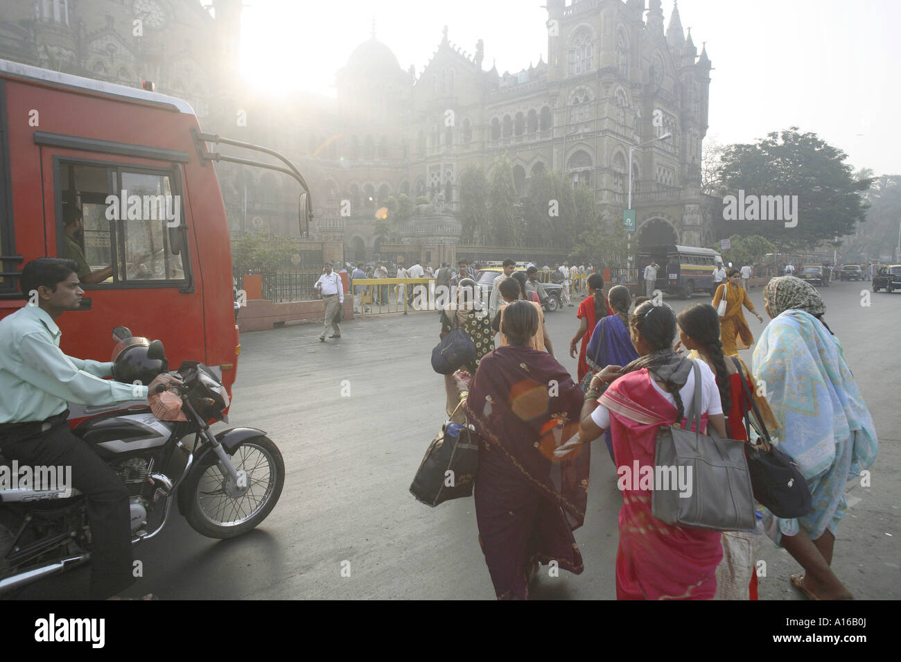 People rushing home to catch train at Victoria terminus railway station building Bombay India Stock Photo
