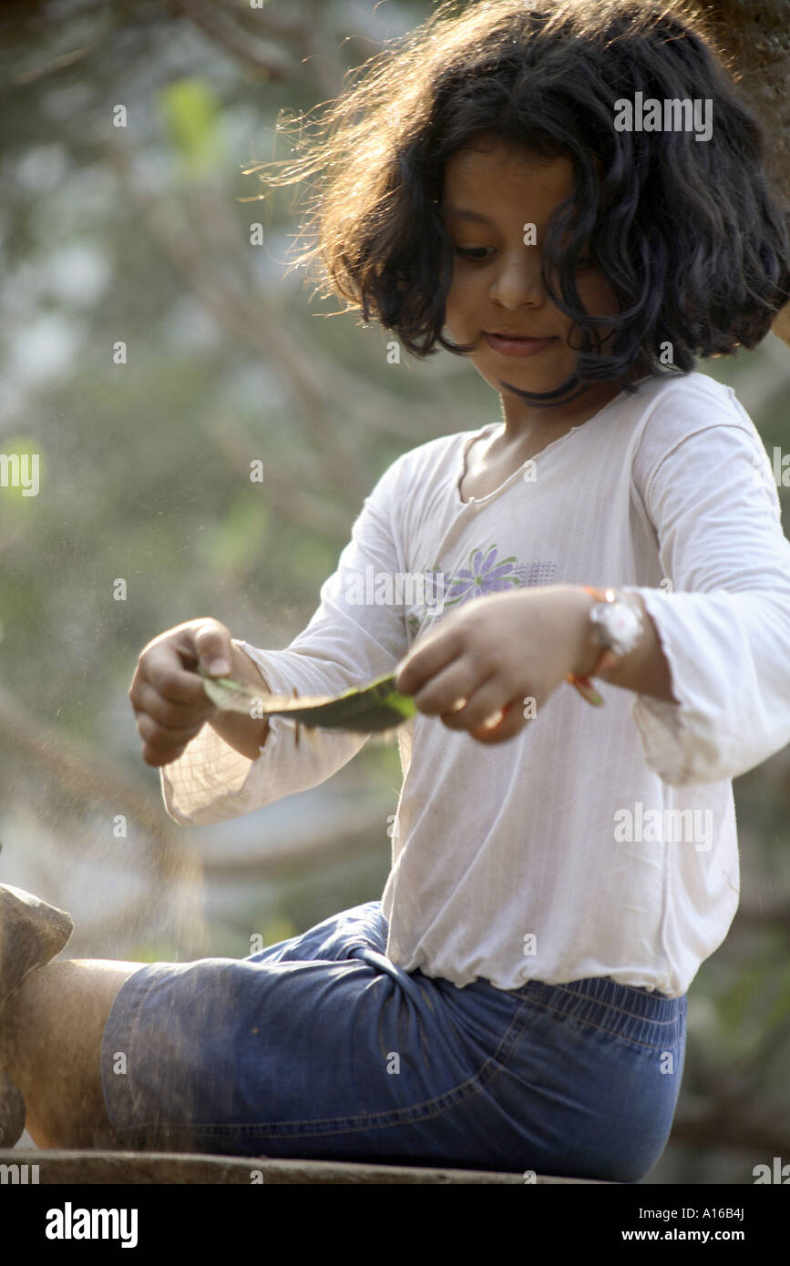 RSC102004 Young Indian little girl playing with sand Bombay Mumbai Maharashtra India Srishti Model released 542 Stock Photo