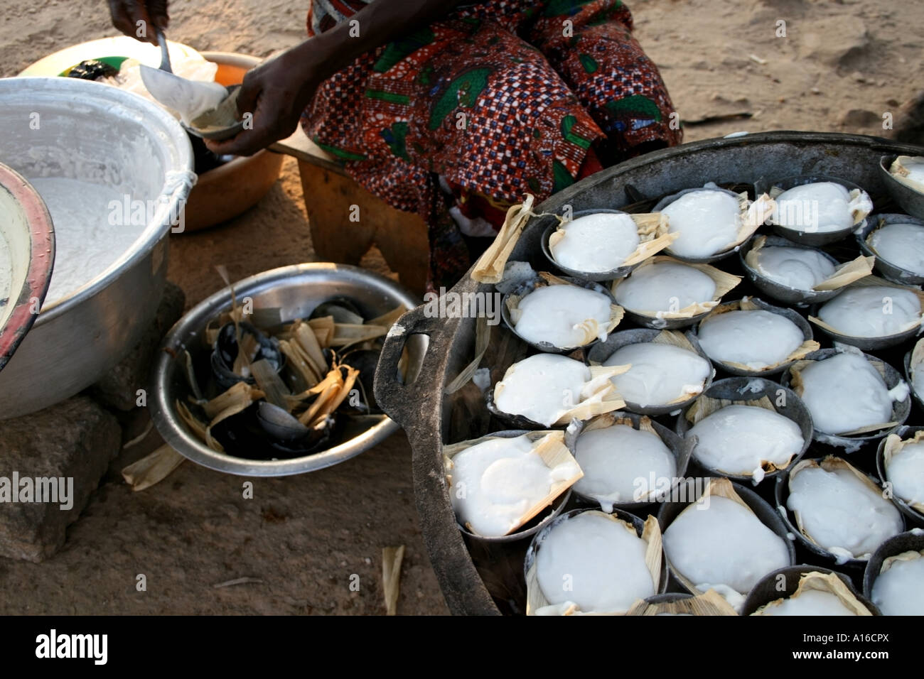 Steamed millet flour dumplings being made on the street for sale
