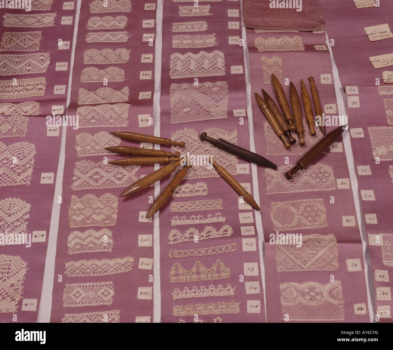 The bobbins used in traditional pillow lace making Stock Photo Alamy