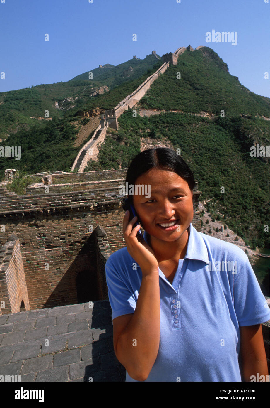 Chinese Han woman on mobile phone at the Great Wall Stock Photo