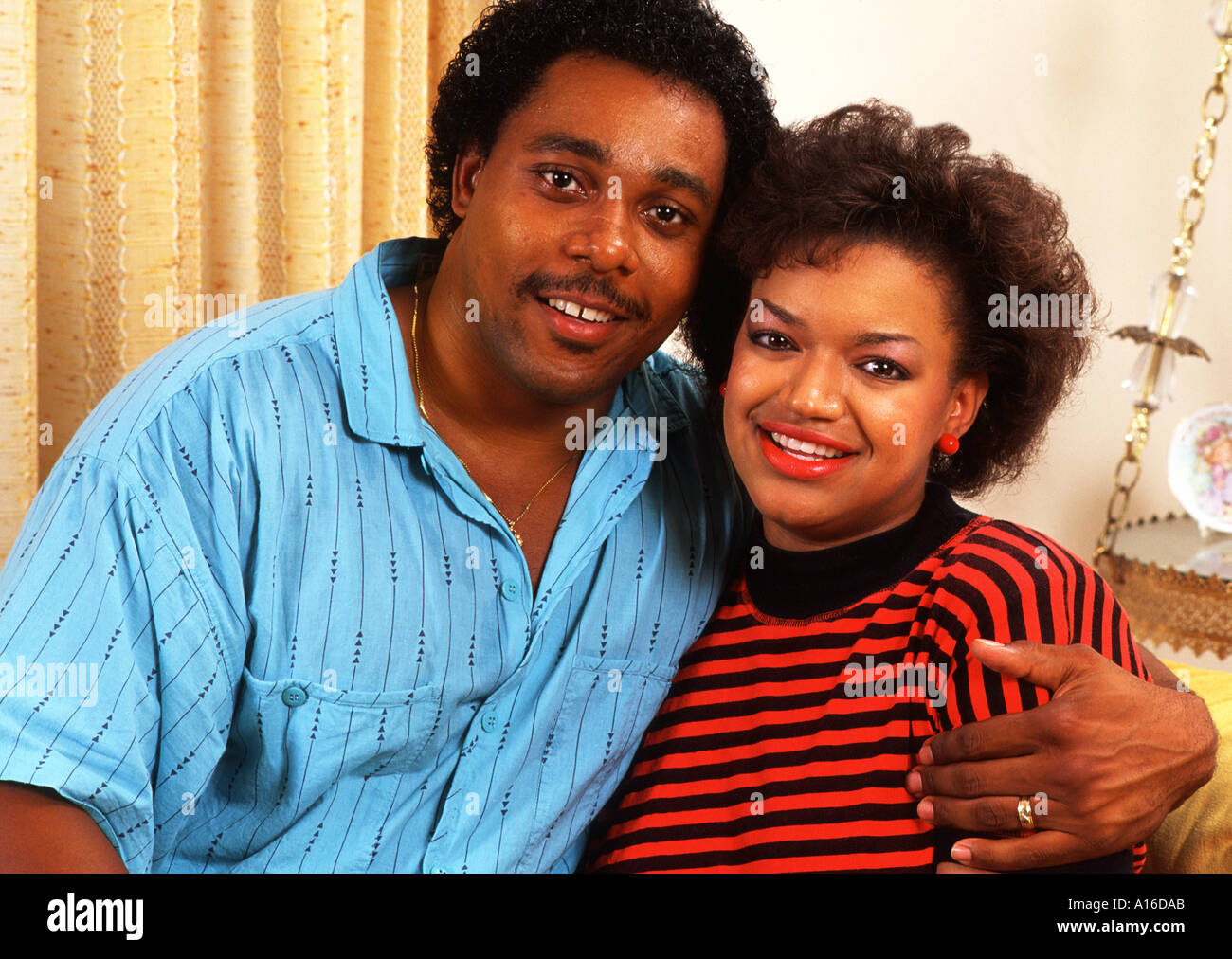 African American couple relaxing together at home Stock Photo - Alamy