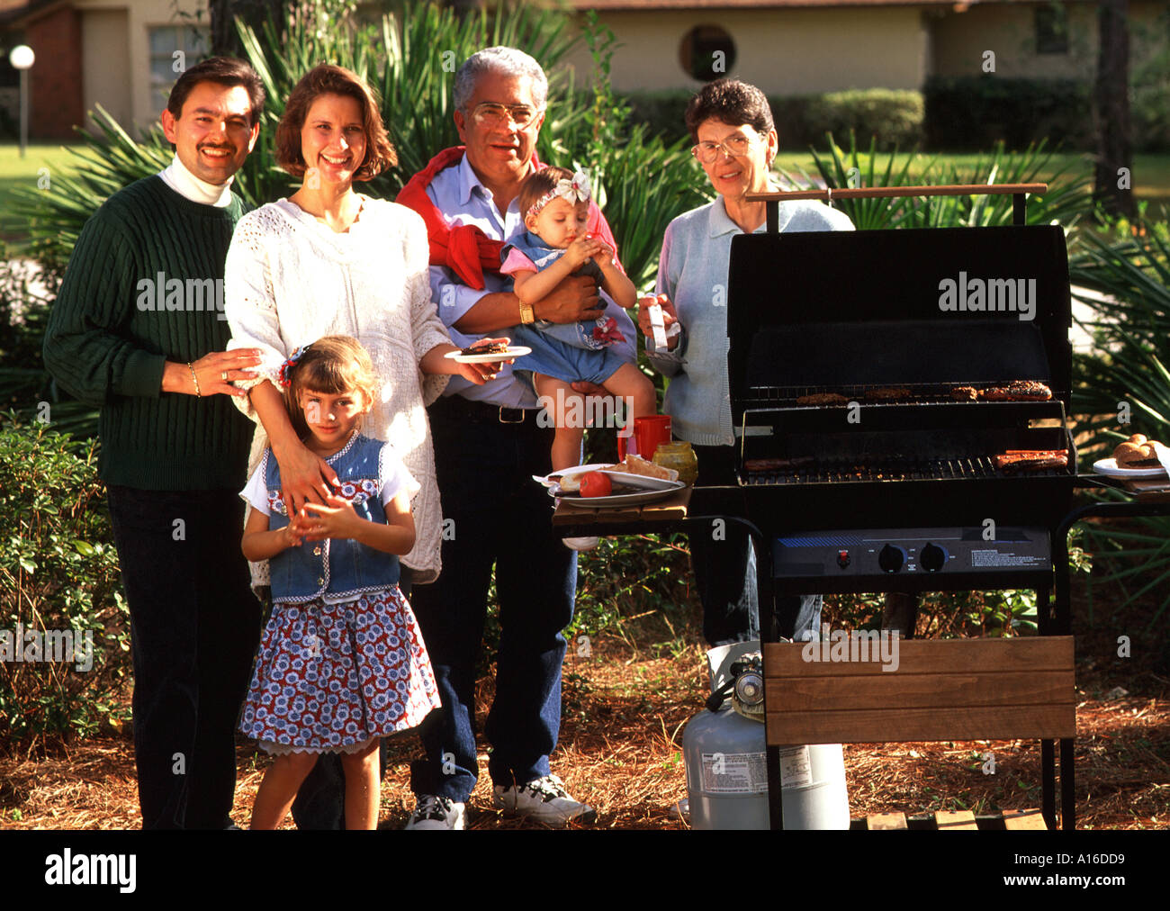 3 generation Hispanic family having a barbecue Stock Photo