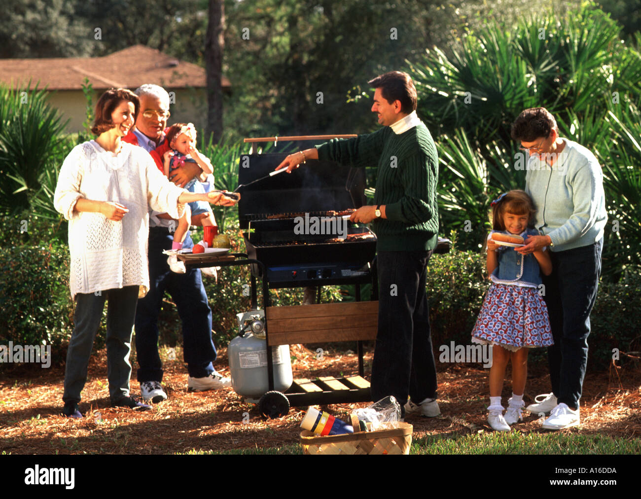 3 generation Hispanic family having a barbecue Stock Photo