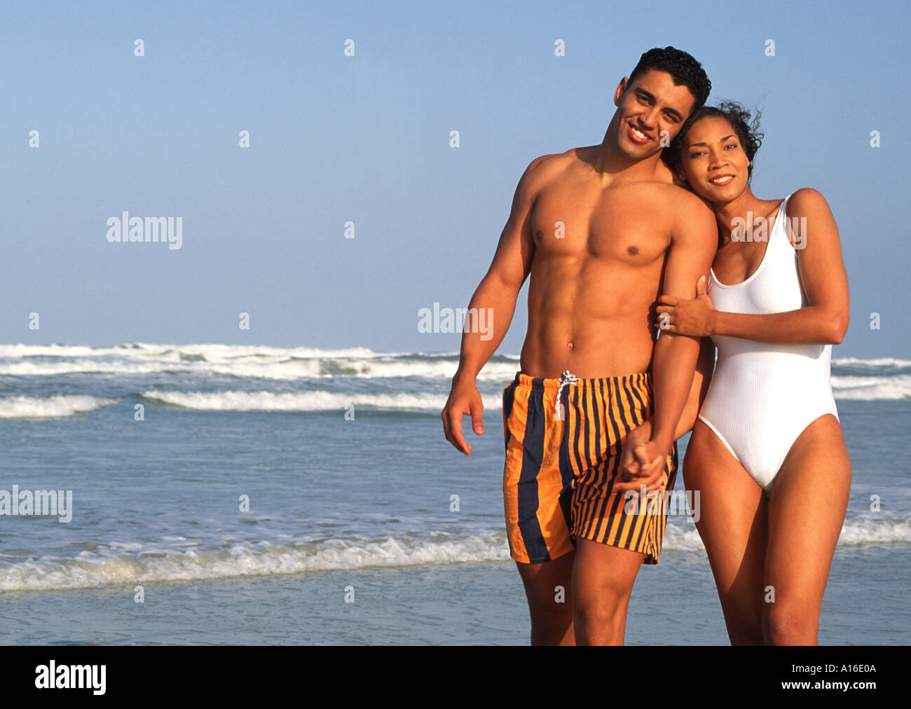 African American couple walking together at the beach Stock Photo