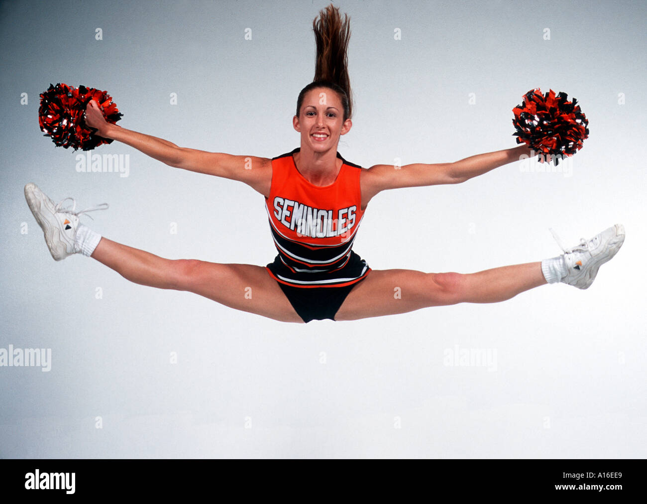 Excitement cheerleader jumping doing split hi-res stock photography and  images - Alamy