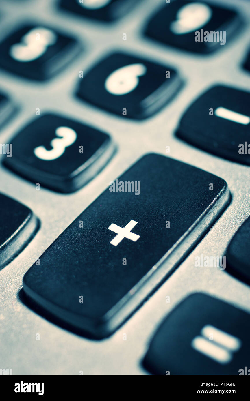 Calculator keypad with focus on addition button stock photo alamy