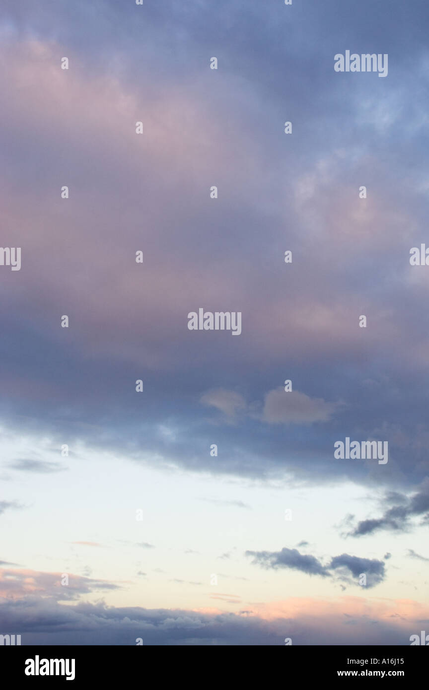Sky at dusk with rim-lit clouds Stock Photo