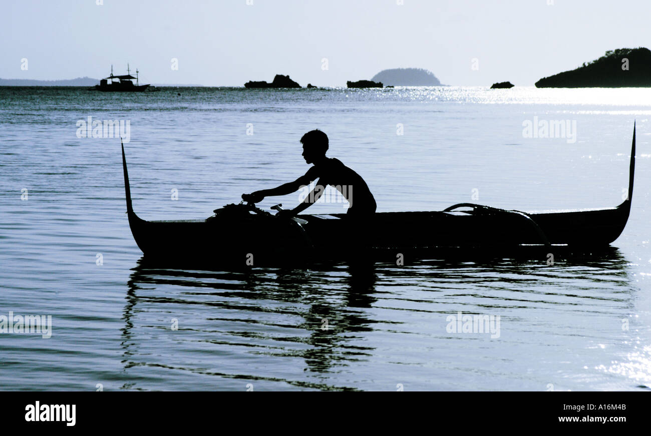 silhouette seascape scene of fisherman in the philippines Stock Photo