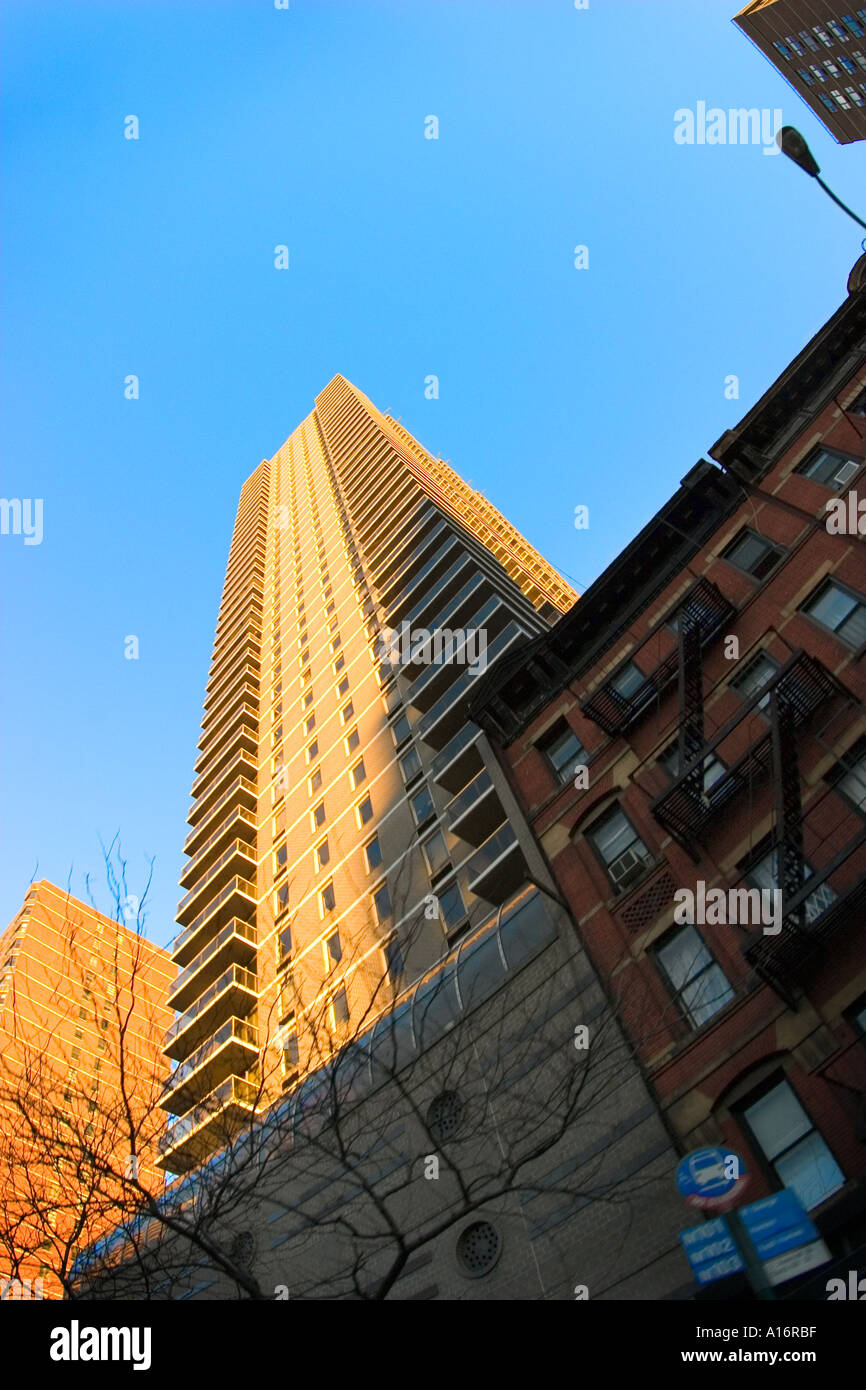 New York city residential apartment buildings shot from below looking upwards towards the sky Stock Photo